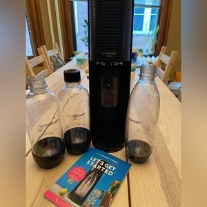 SodaStream Machine with 2 extra bottles, used once.